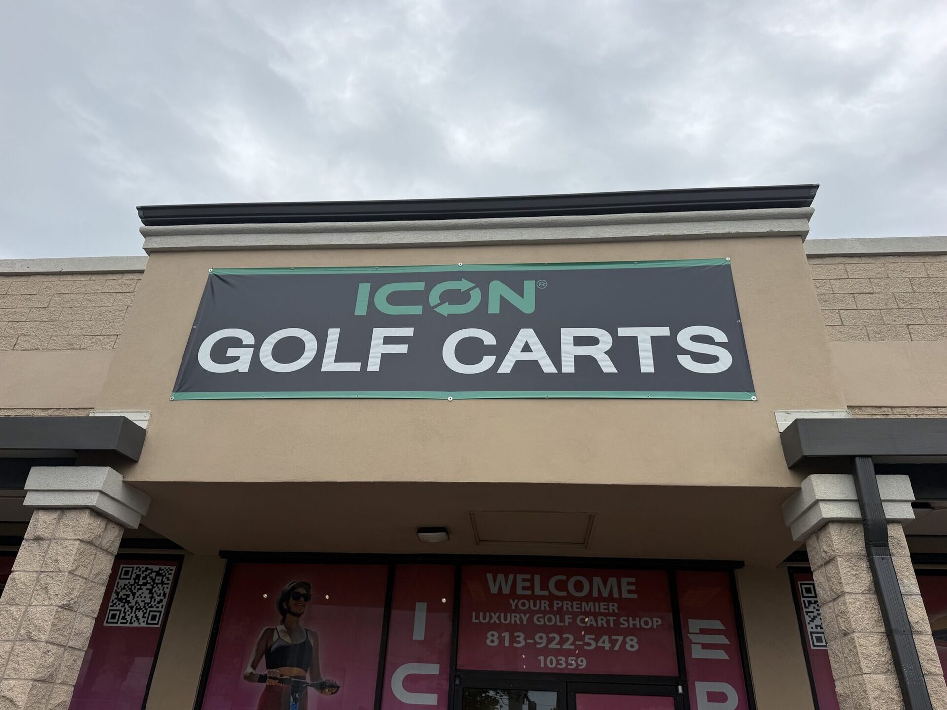 ICON Golf Carts storefront exterior with the charcoal and teal signage banner